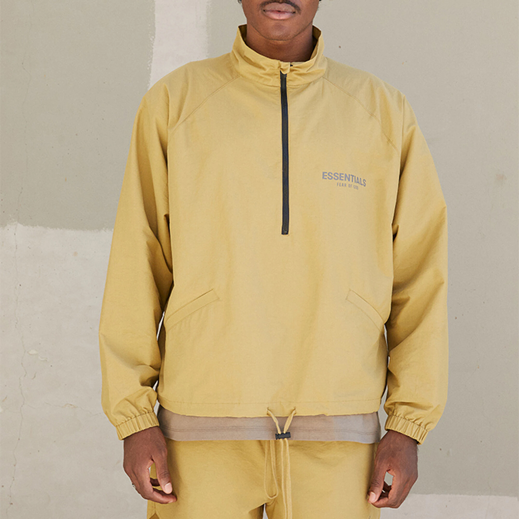 Fear of God Essentials FW21 Half Zip Track Jacket Amber Logo   