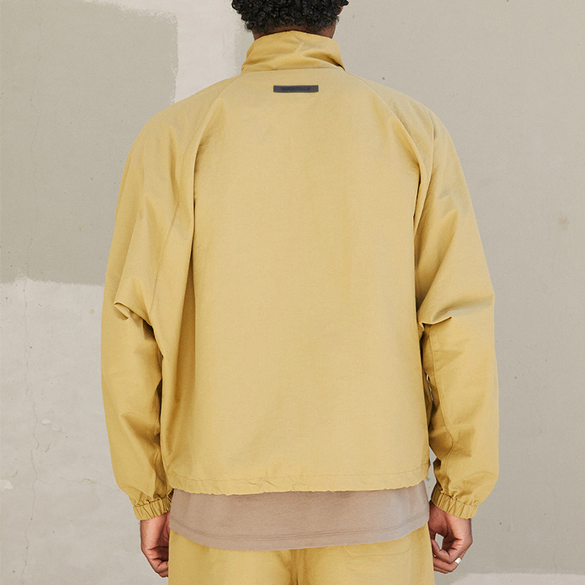 Fear of God Essentials FW21 Half Zip Track Jacket Amber Logo   