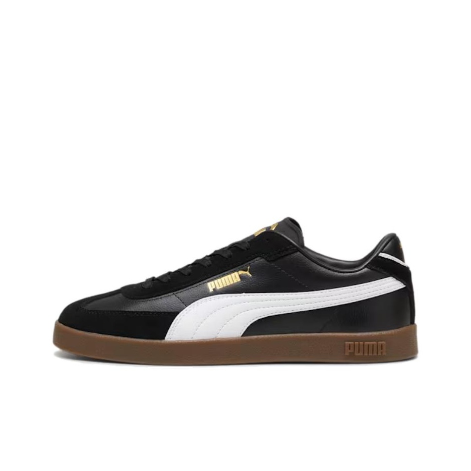 gold and black puma shoes