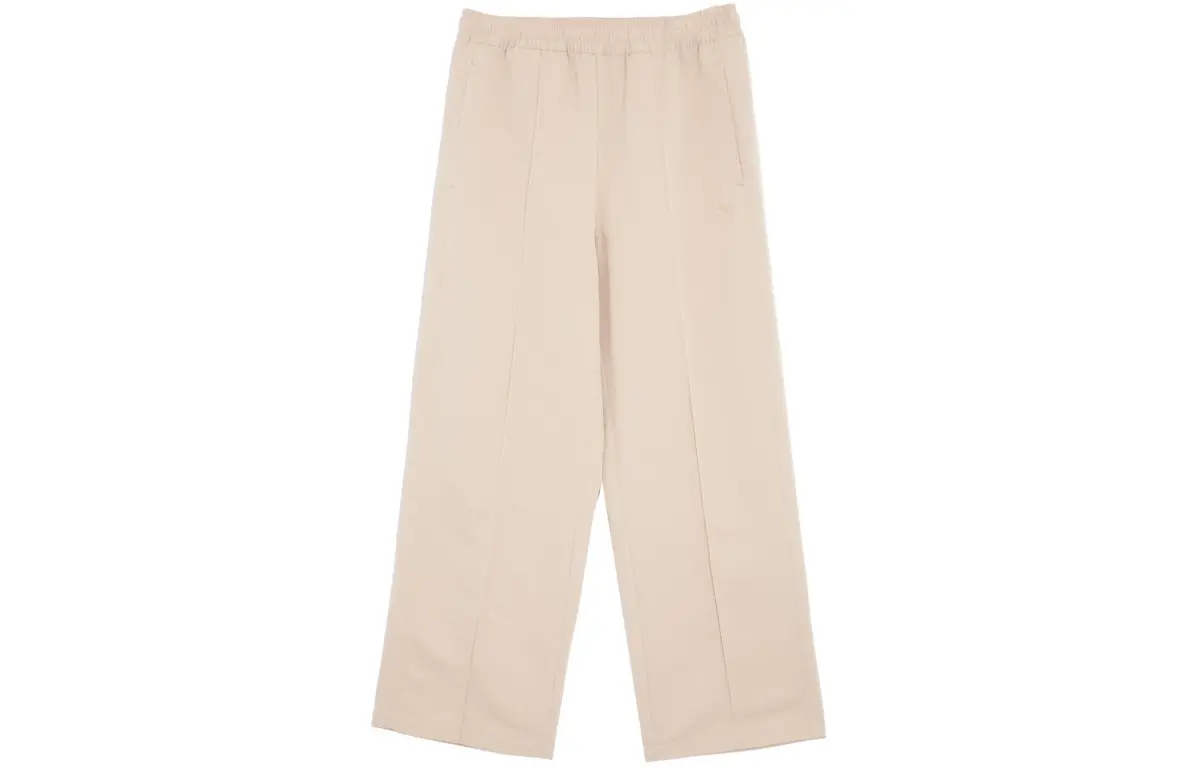 PUMA APRES COURT WOVEN PANTS Casual Pants Unisex Pine Sand