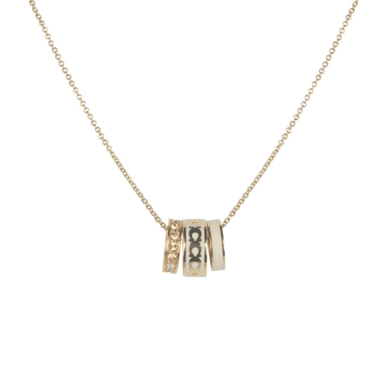 COACH Carved brass enamel, golden necklace