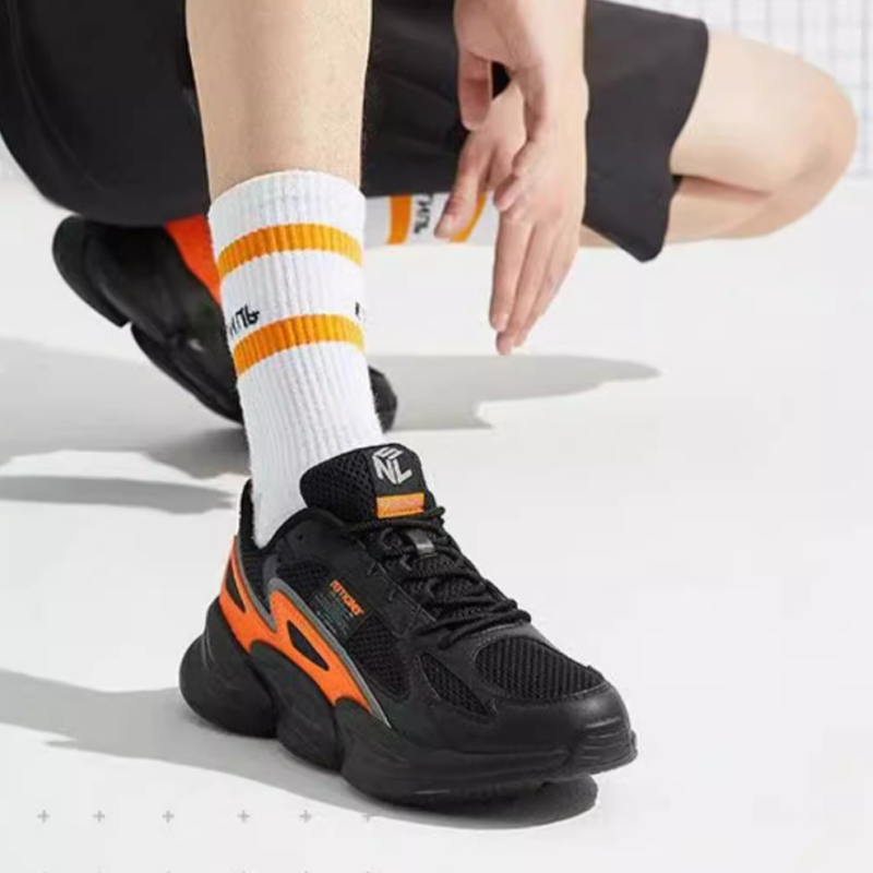 QIAODAN Slip Resistant Mid top Running Shoes Men’s Sun Orange